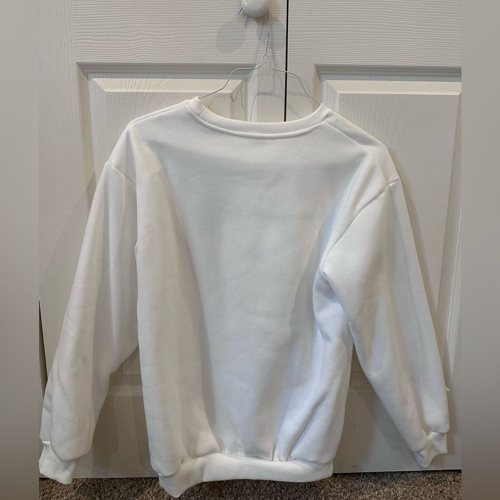White pull-over. Large in women’s